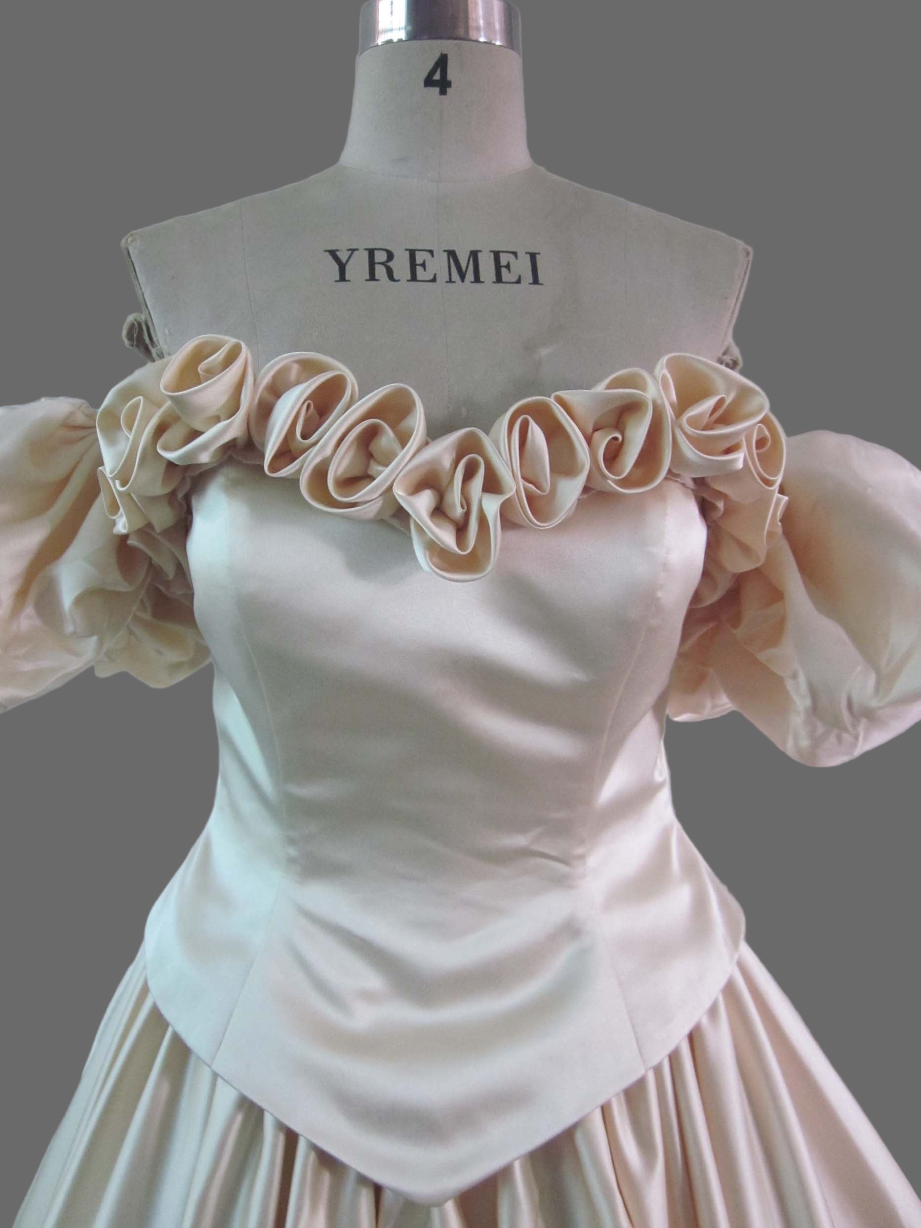 Champagne Off-Shoulder Ball Gown Wedding Dress with Ruffled Neckline and Cathedral Train