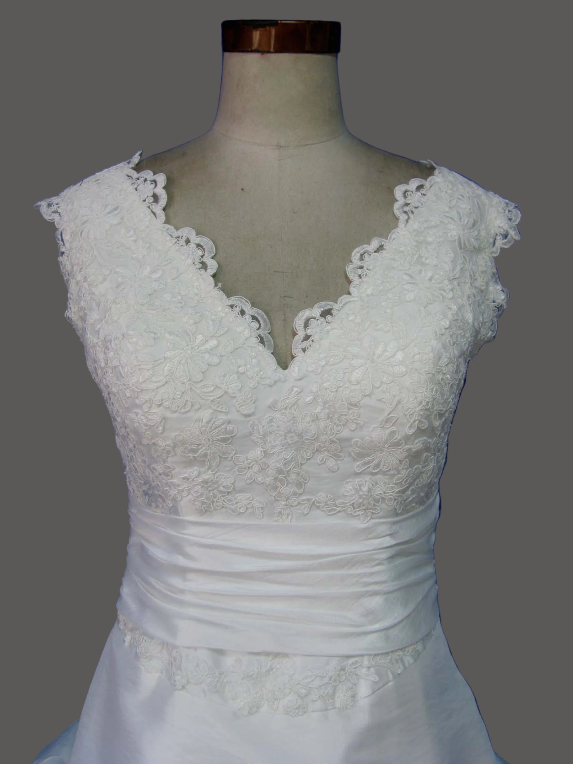 Elegant V-Neck Lace Wedding Dress with Ruched Waist and Tiered Ballgown Skirt