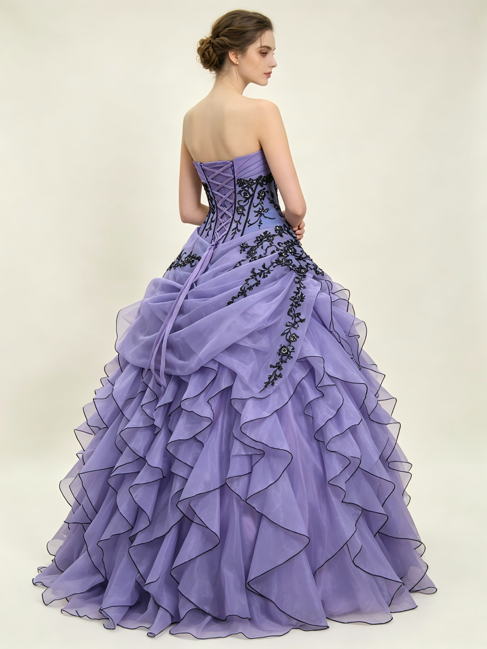 Lavender Purple Quinceanera Ball Gown with Black Floral Appliqué & Cascading Ruffle Organza Skirt